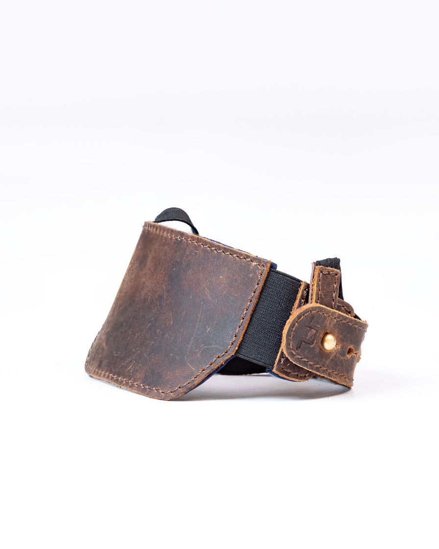 Brown leather shoe protector on a white background