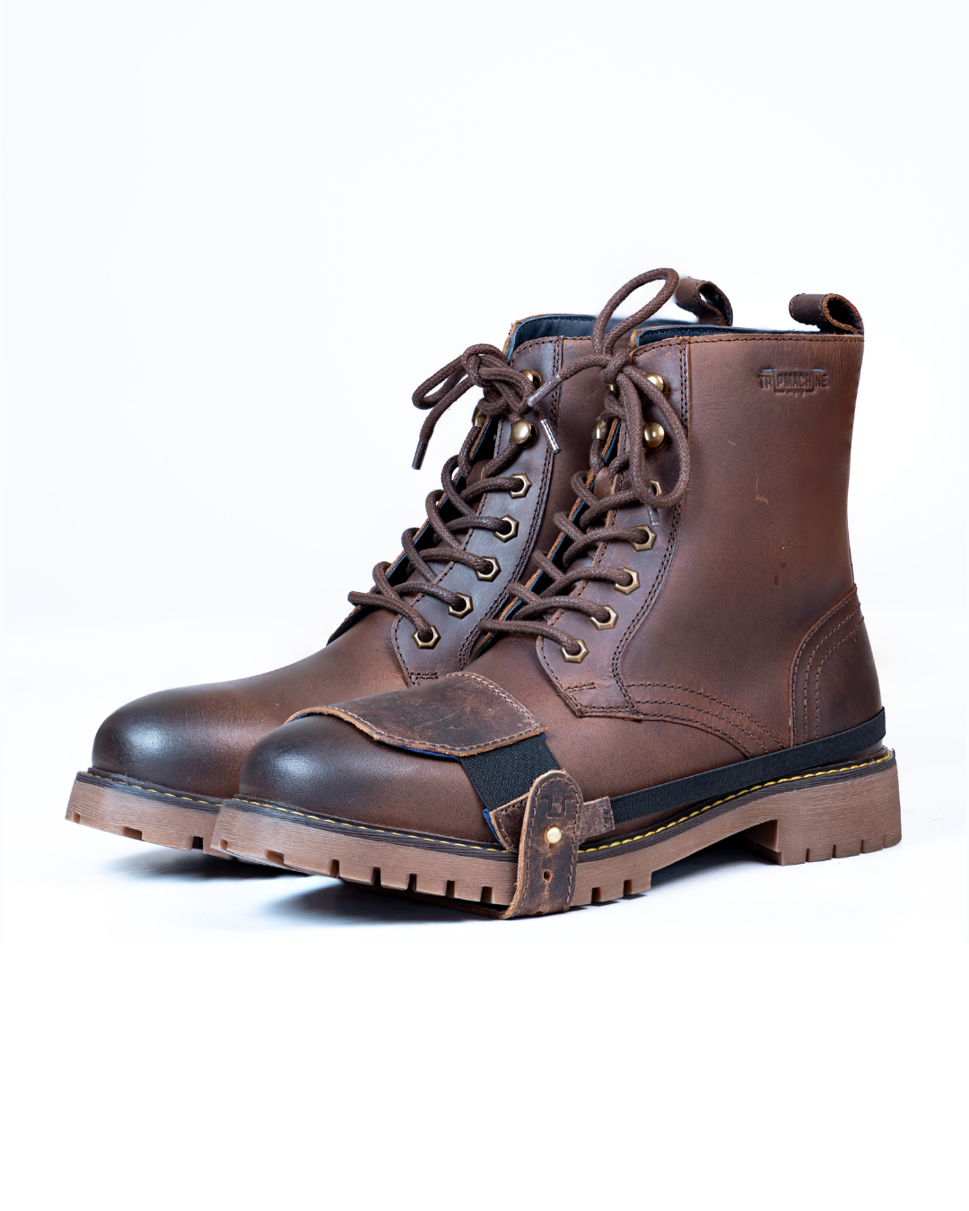 Brown leather boot with mocha shoe protector on a white background