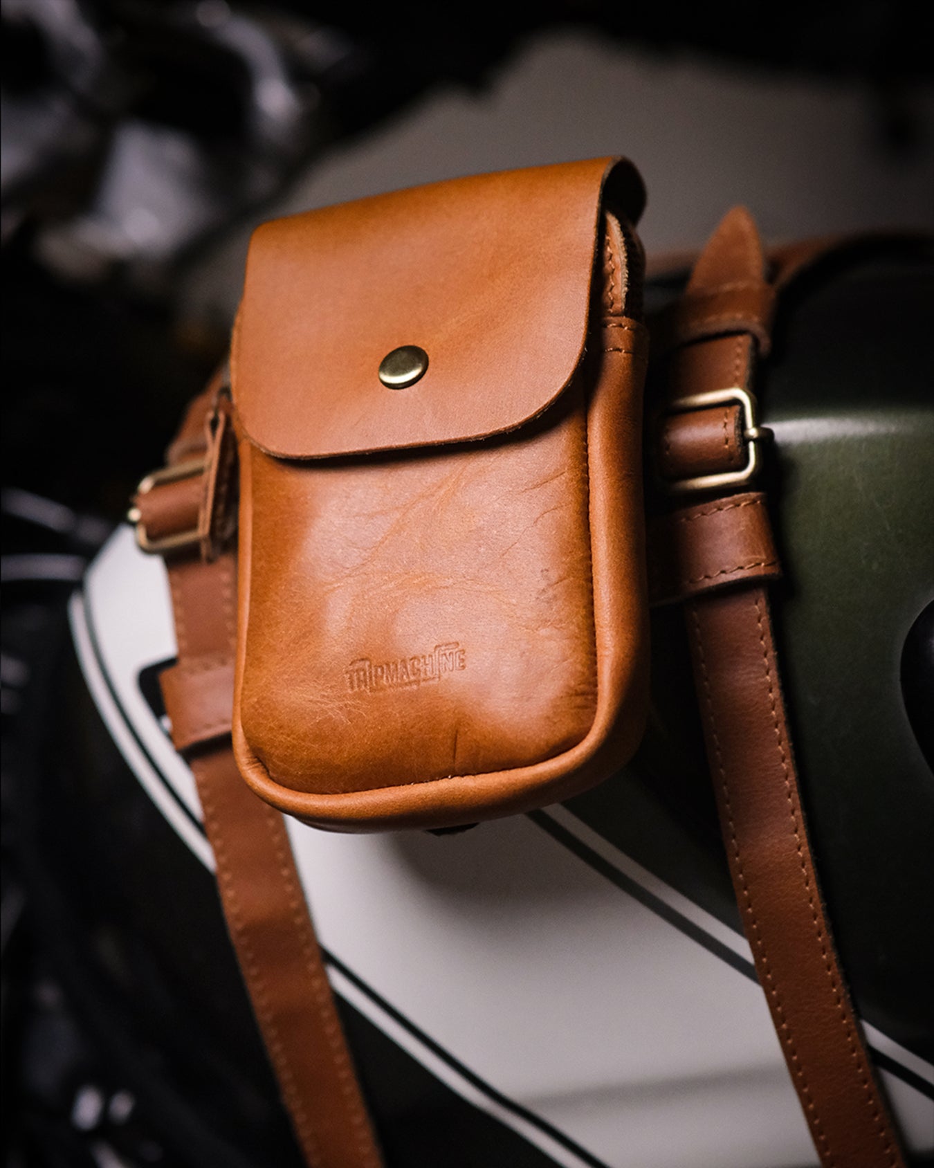 Brown leather pouch attached to a motorcycle helmet