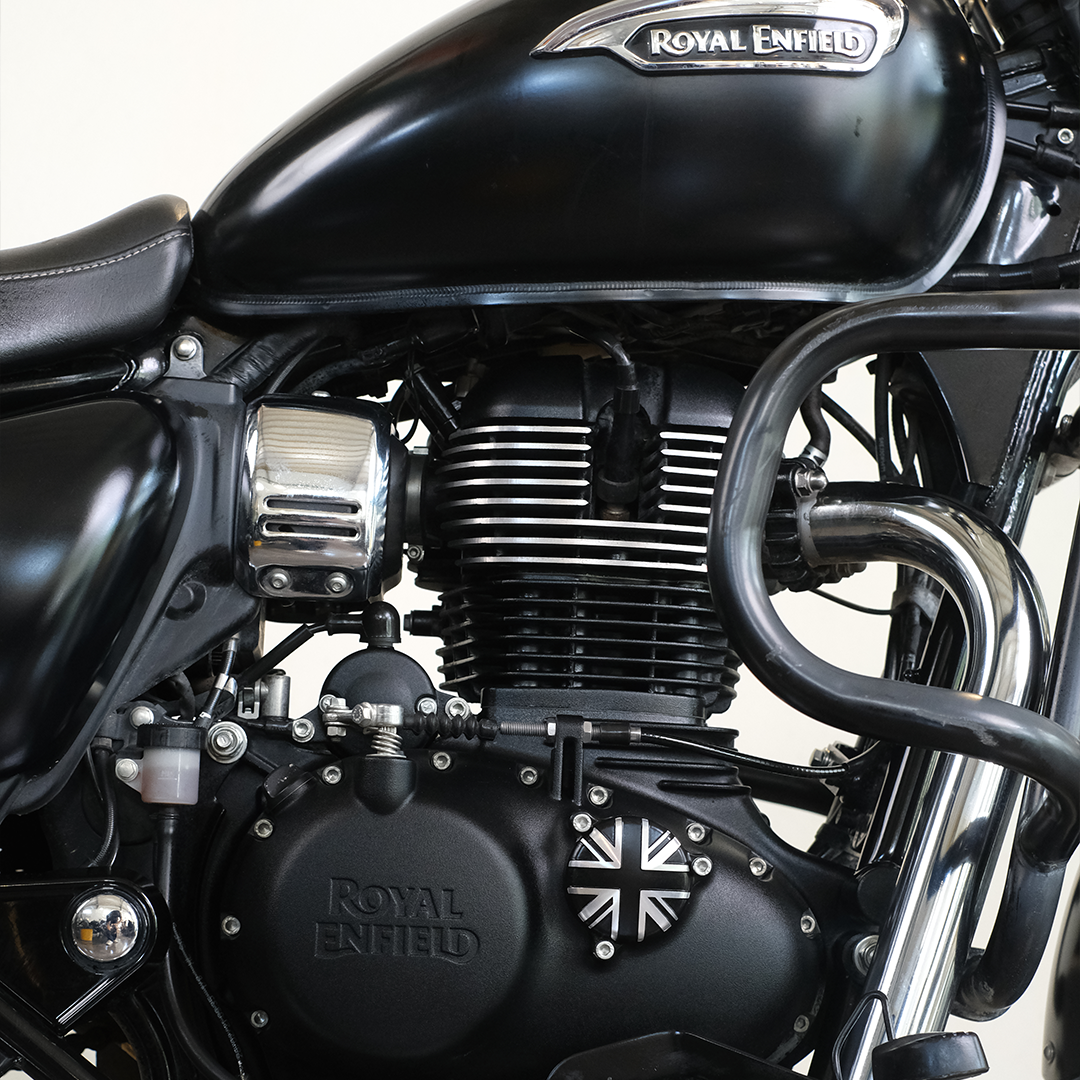 Close-up of a Royal Enfield motorcycle engine with the brand logo visible.