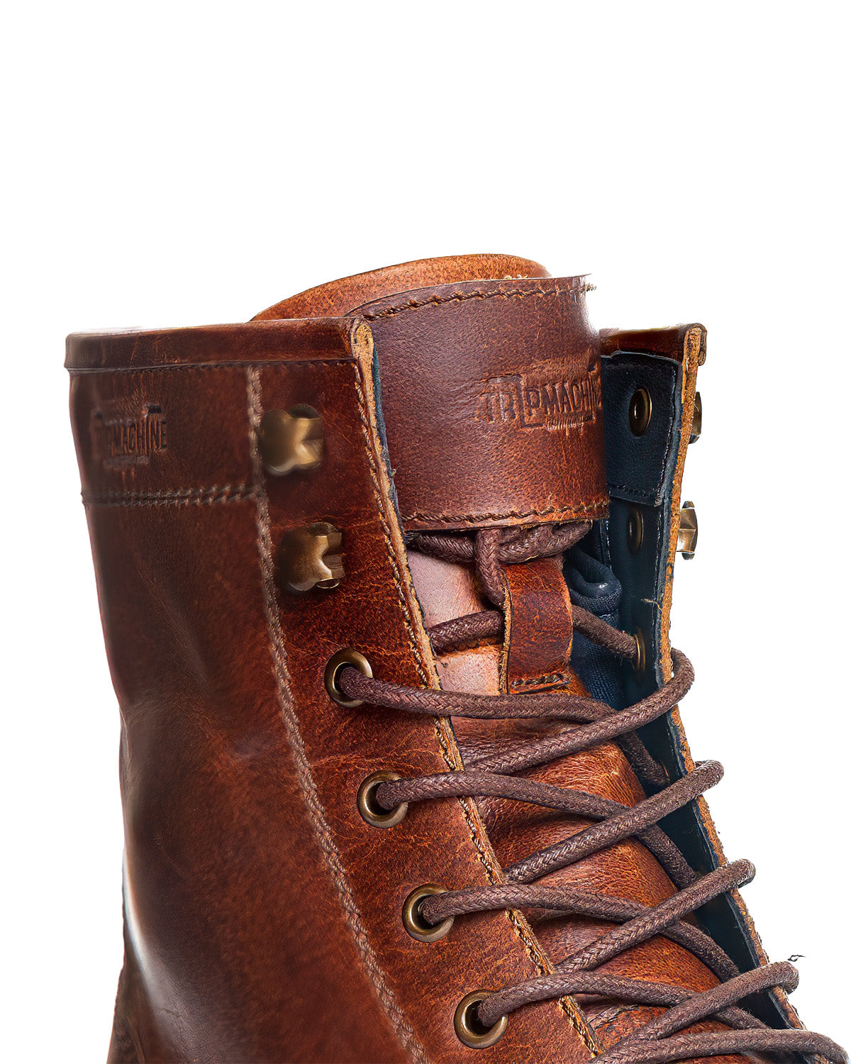 Close-up of a brown leather boot with visible branding on a white background