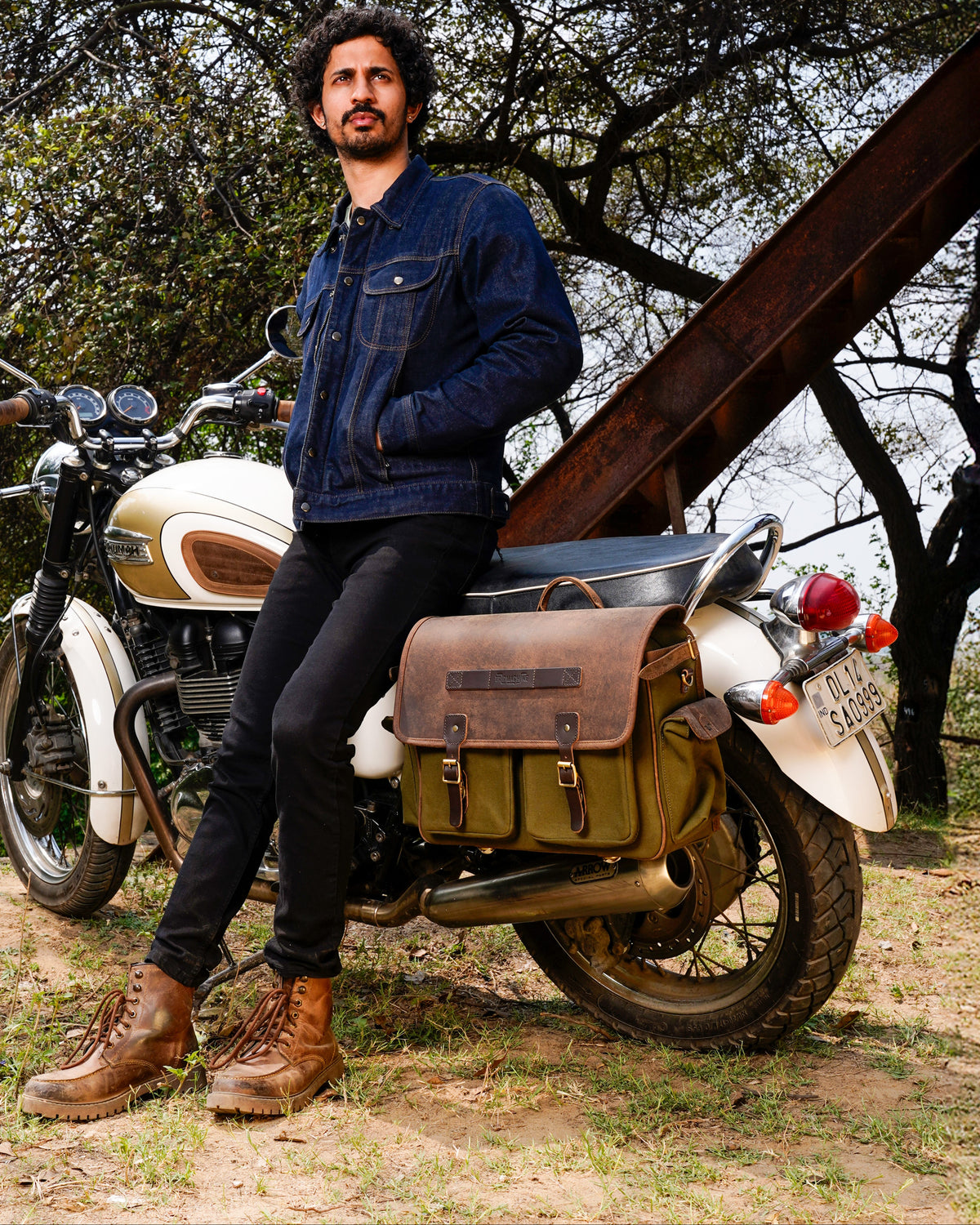 This image features a stylish and rugged expedition saddlebag designed specifically for the Triumph Bonneville series, including the Super Meteor 650, Shotgun 650, and Meteor 350 models. The saddlebag, crafted from 16 oz heavy-duty canvas and complemented by a leather finish, showcases a sturdy and durable design.