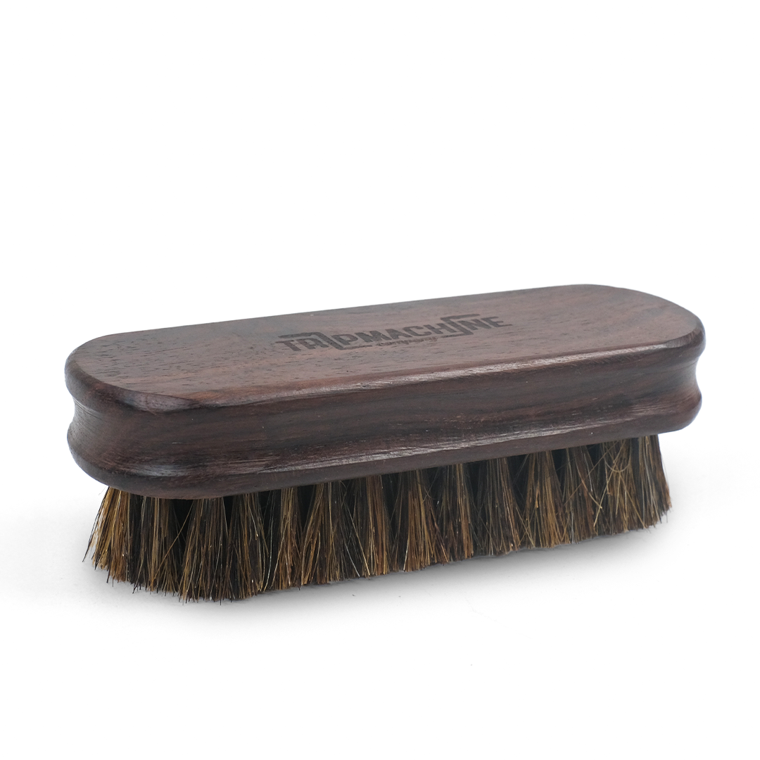Wooden brush with bristles on a white background