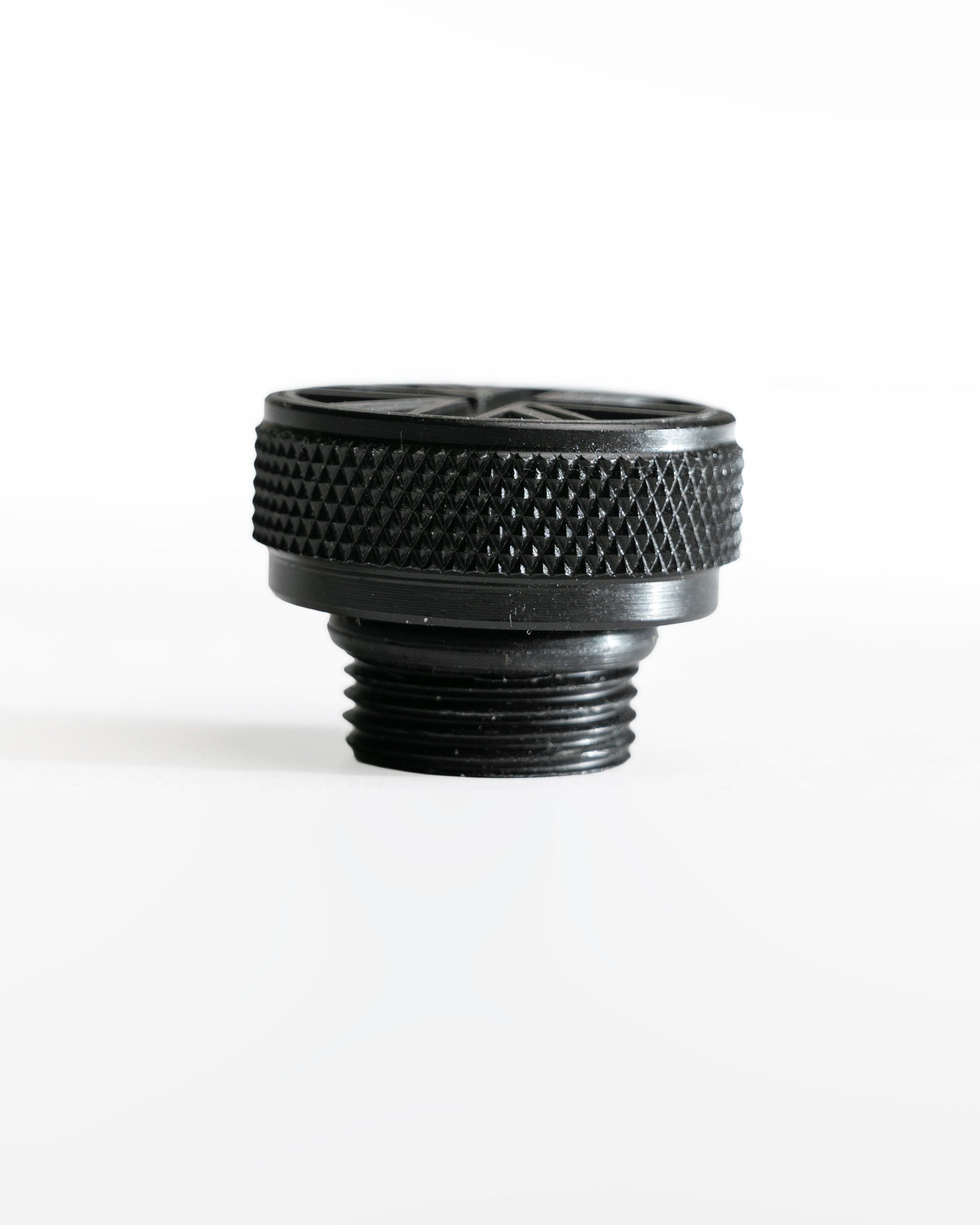 Black threaded fitting on a white background