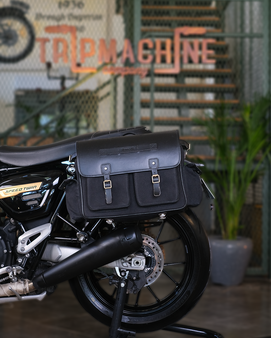 Motorcycle with black saddlebags in a casual setting