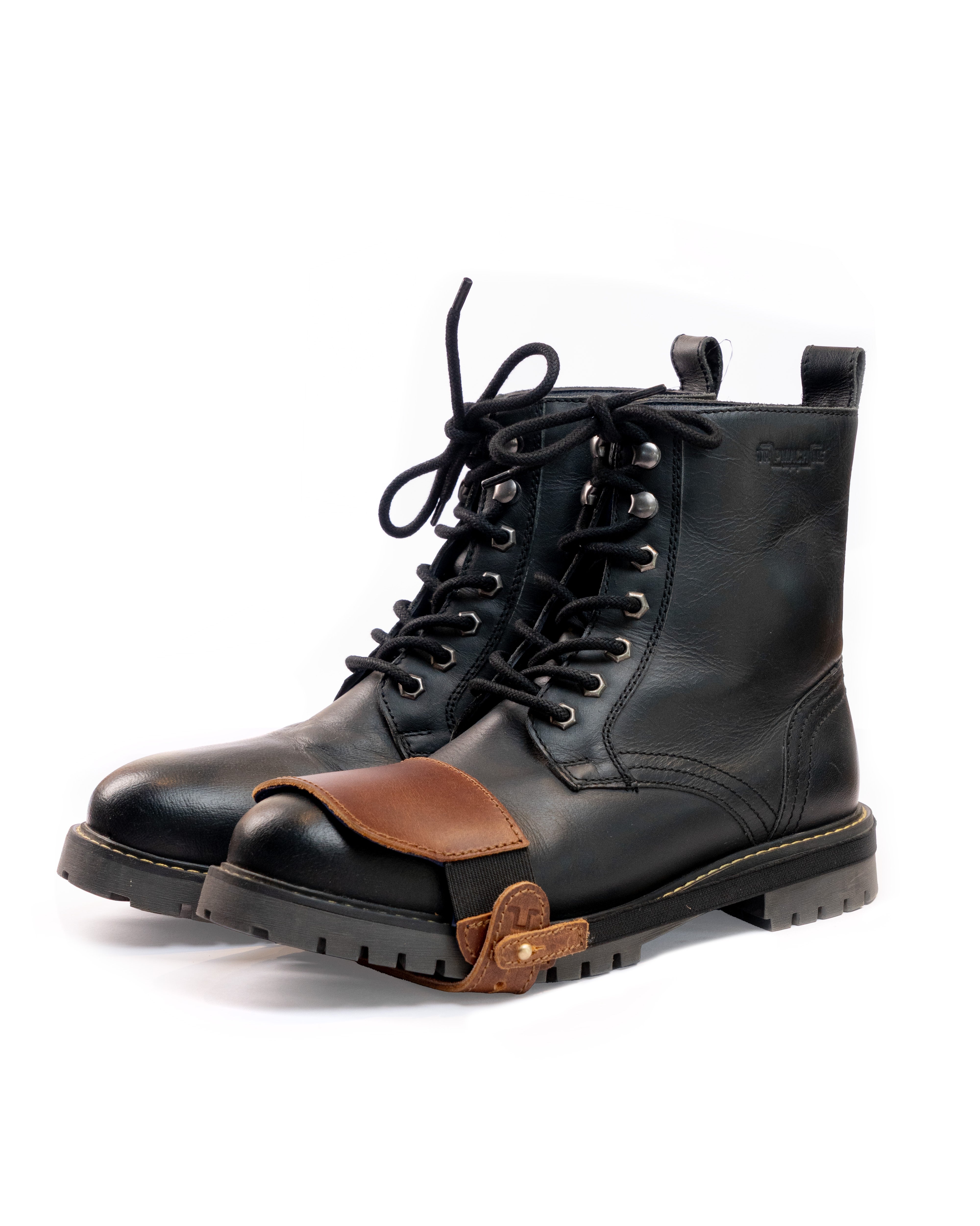 Black leather boots with Cognac shoe protector on a white background