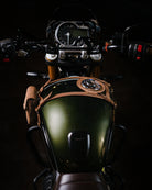 Close-up of a motorcycle's tank strap with pouch with a dark background