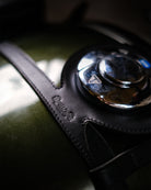 Close-up of a car's gear shift lever with a leather cover