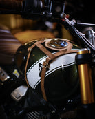 Close-up of a motorcycle tank strap on a blurred background