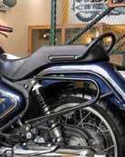 Close-up of a bullet 650 motorcycle with saddle stay inside a building