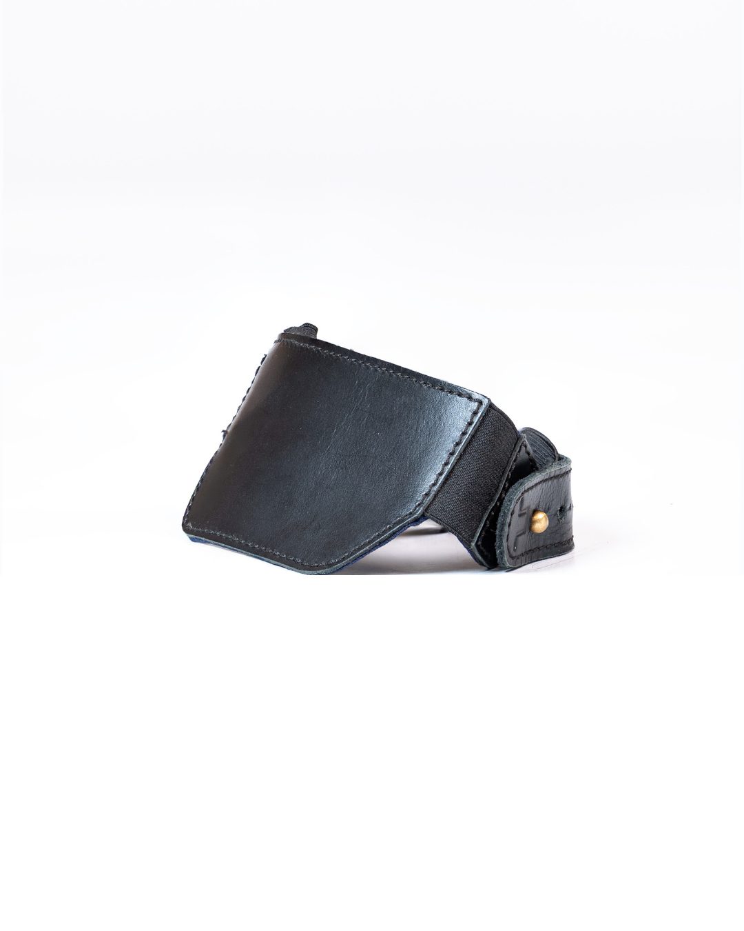 Black leather shoe protector on a white background
