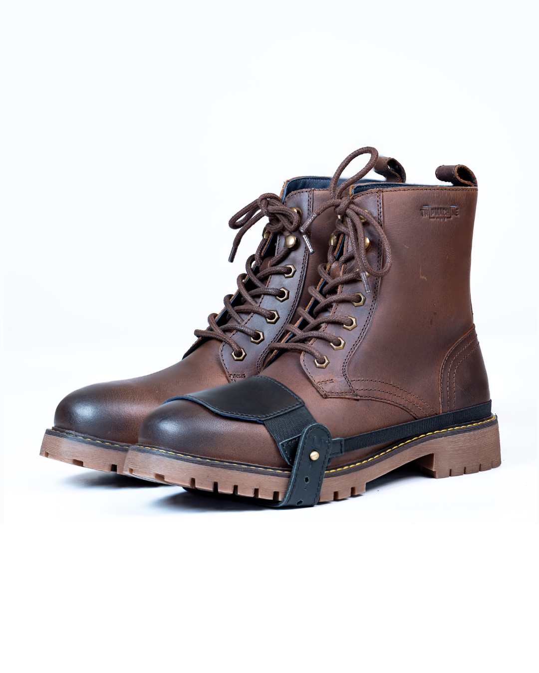 Brown leather boot with black shoe protector on a white background