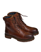 Pair of brown leather boots on a white background