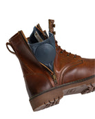Brown leather boot with a blue insole on a white background