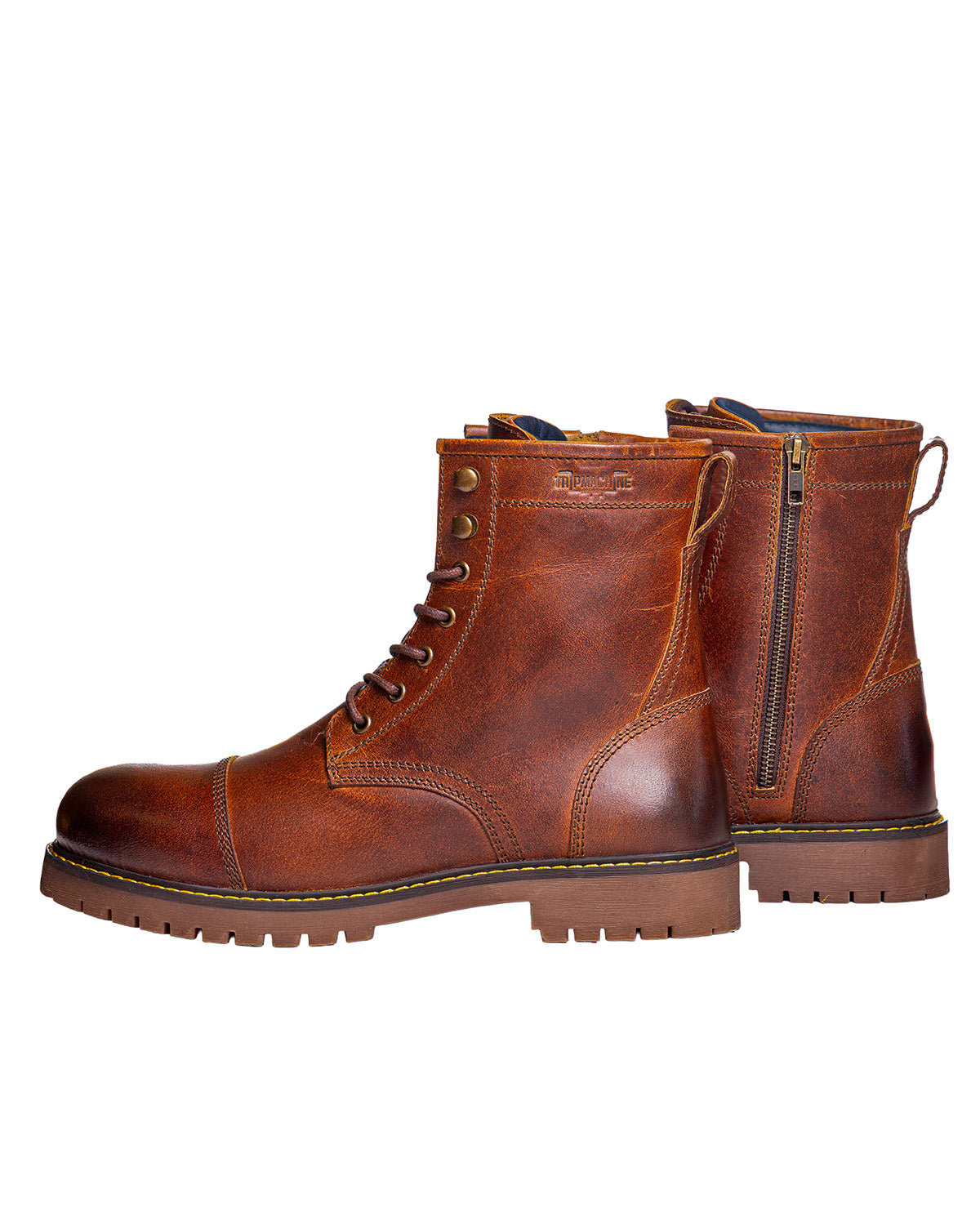 Pair of brown leather boots with a zipper on a white background