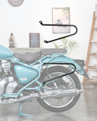 Motorcycle with a black luggage rack in a room setting