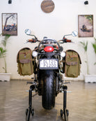 Motorcycle with saddlebags on a stand in a showroom setting