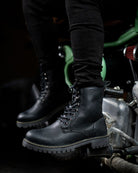 A man seated on a bike with black color handmade genuine leather derby boots with with ankle, toe and heel protector for bikers