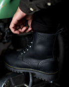 Side view of a man wearing black color handmade genuine leather derby boots with ankle, toe and heel protector for bikers 