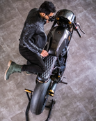 Man sitting on a bike with handmade genuine leather derby forest green boots with ankle, toe and heel protector for bikers