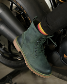 Side view of a man on bike with handmade genuine leather derby forest green boots with ankle, toe and heel protector for bikers