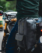 Handmade genuine leather black color eastwood backpack mounted as a saddlebag on a bike