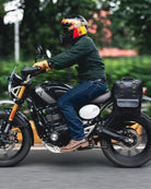 Handmade genuine leather black color eastwood backpack mounted as a saddlebag on a bike running on a road