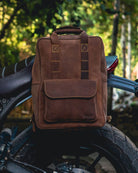 Handmade genuine leather brown color eastwood backpack mounted on a bike as saddlebag