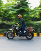 Handmade genuine leather brown color eastwood backpack mounted as saddlebag on a running bike