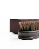 Wooden brush with bristles on a white background
