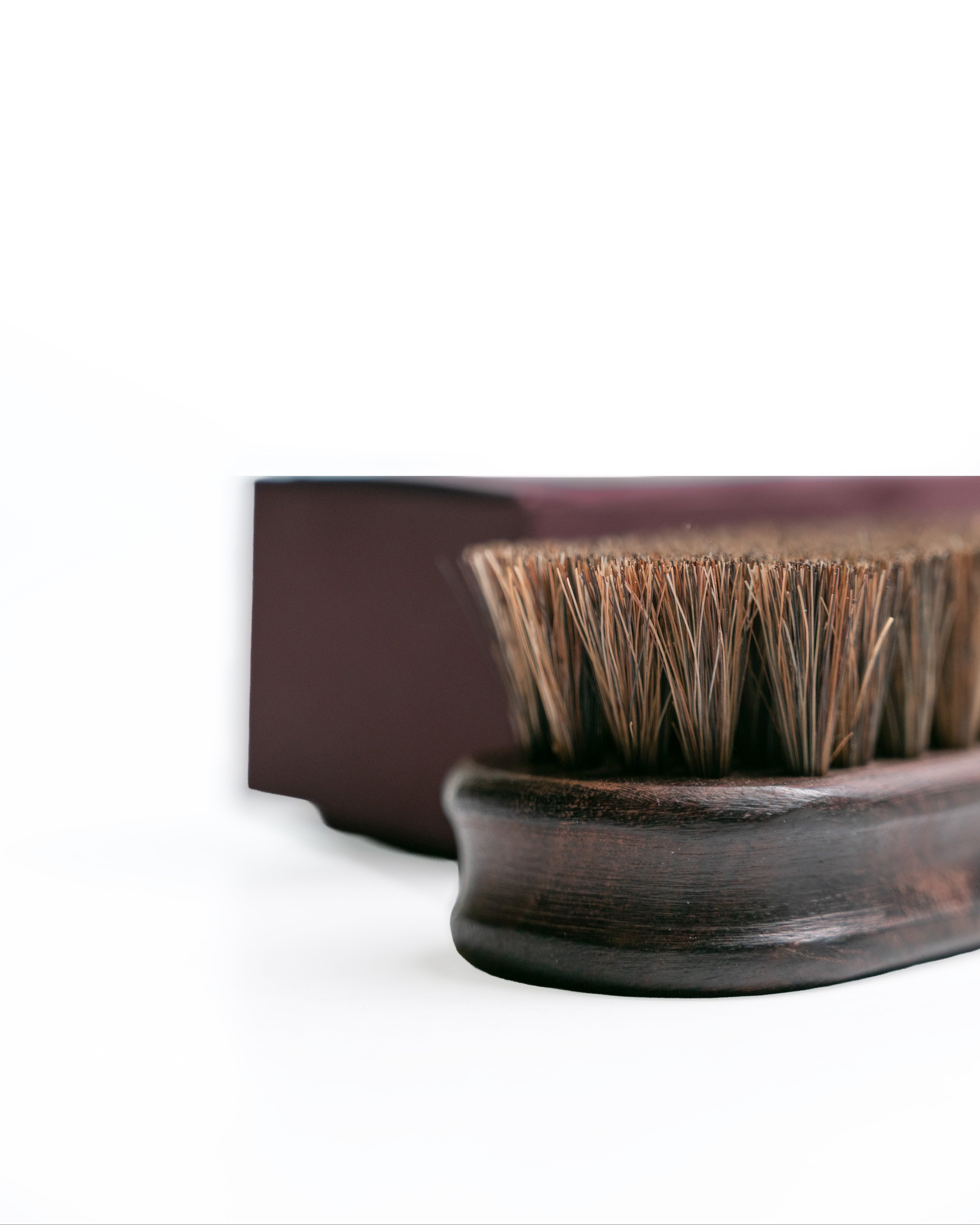 Wooden brush with bristles on a white background