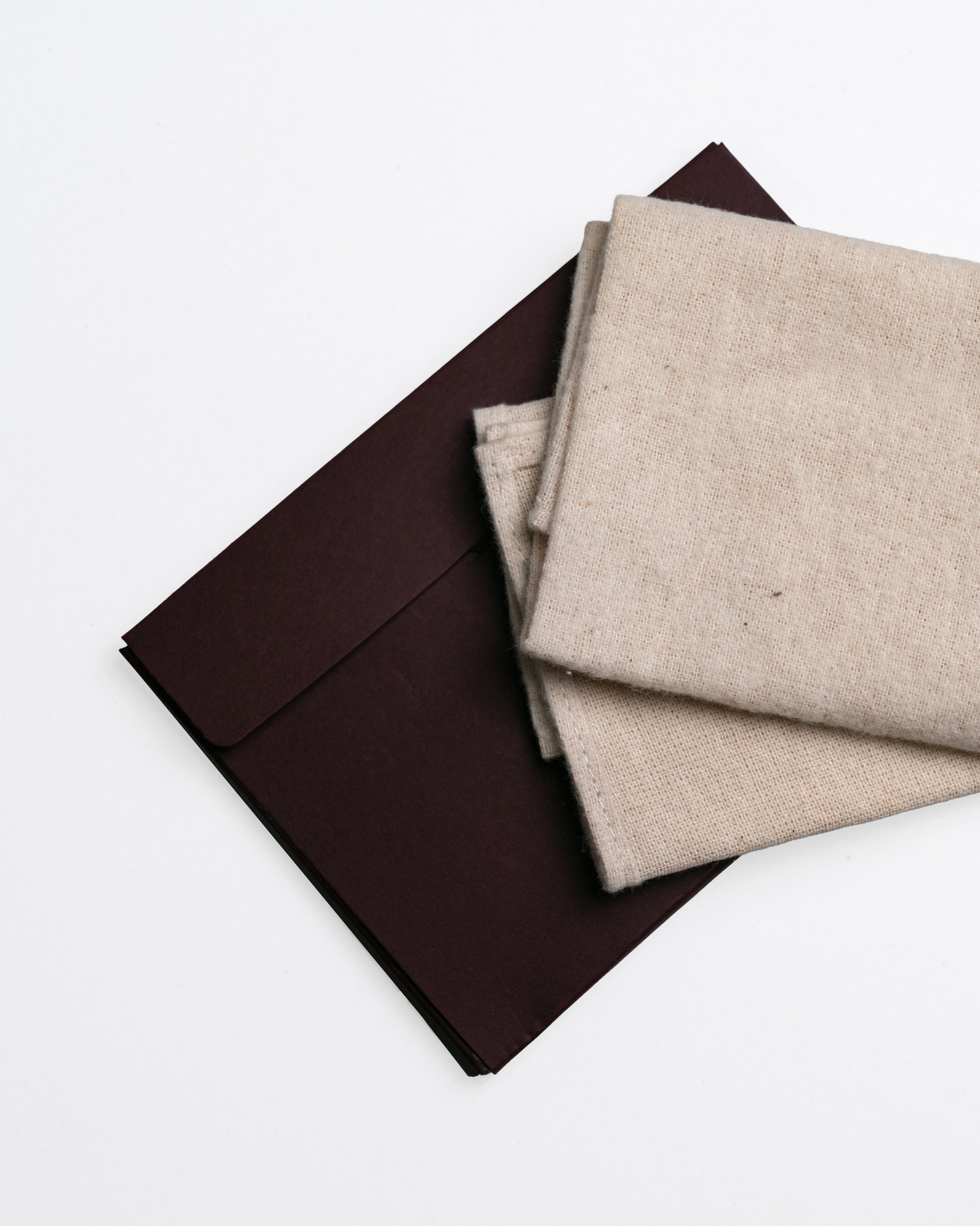 Cleaning cloth with brown envelope on a white background