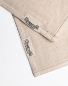 Beige fabric with 'Trip Machine' branding on a white background