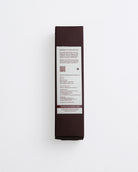 Dark brown product box with white label on a light gray background