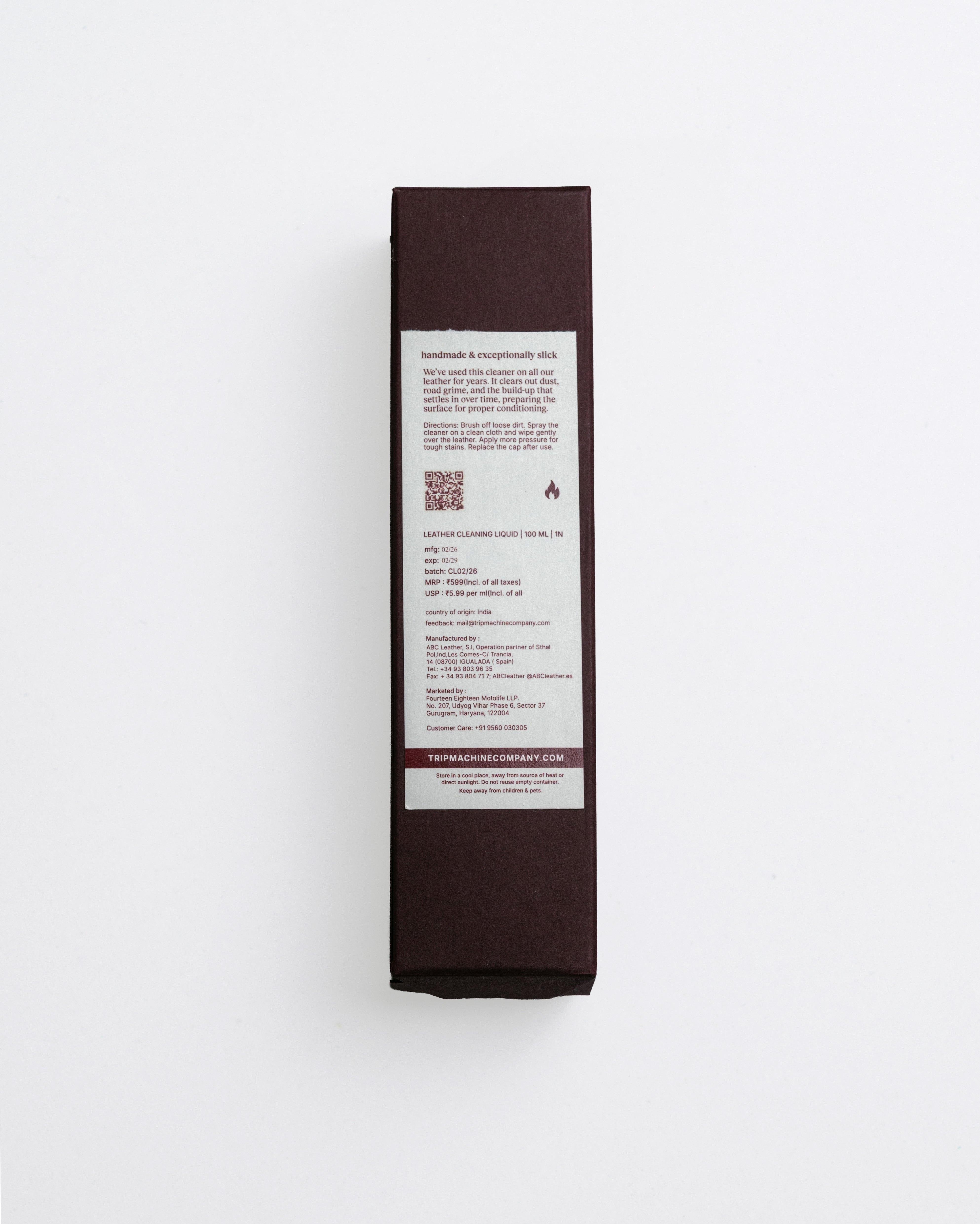 Dark brown product box with white label on a light gray background