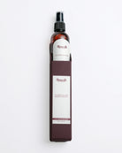 Leather cleaner spray bottle with a white label on a white background