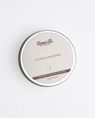 Leather conditioner container with 'TripMachine' branding on a white background