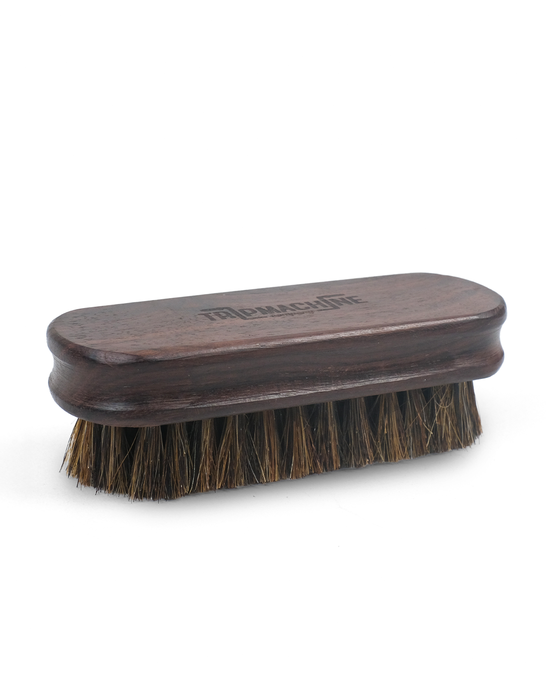 Wooden brush with bristles on a white background