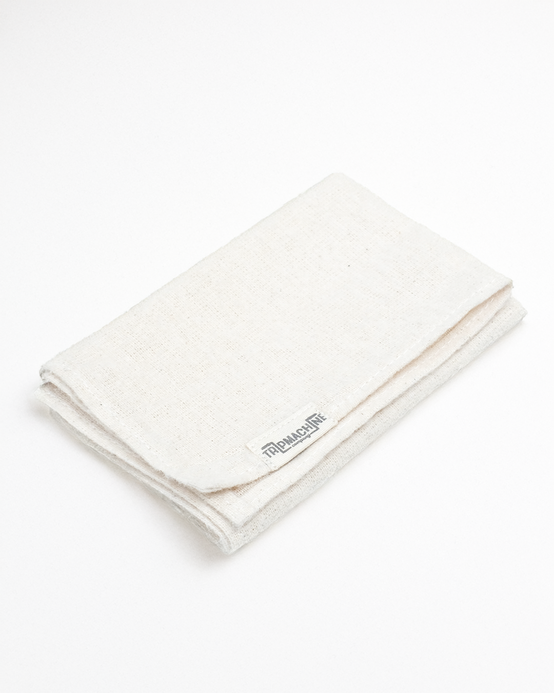 Folded white cloth with a brand logo on a white background
