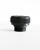 Black threaded fitting on a white background